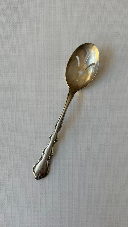 Strained serving spoon
